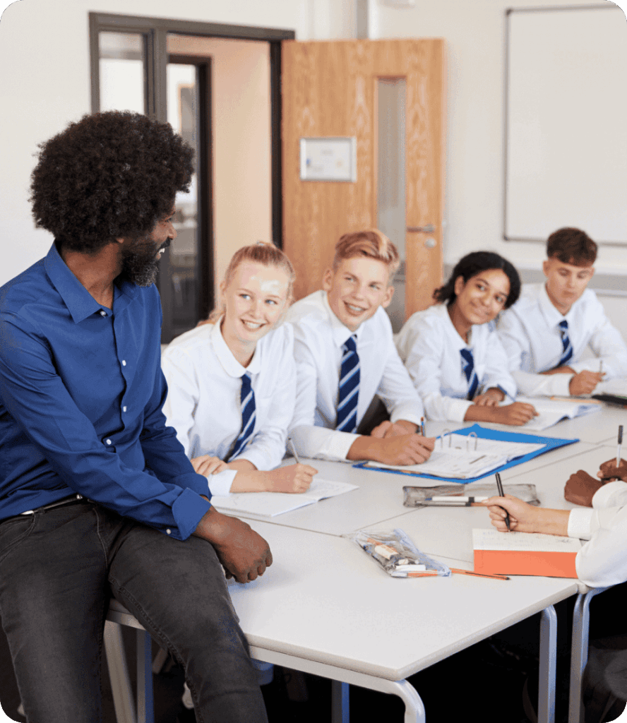 Male teacher talking to students