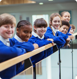 School students lean on railing
